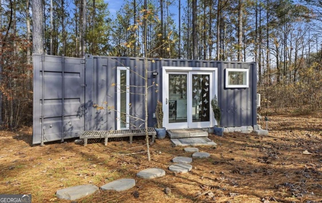 The container spa tucked among the pines