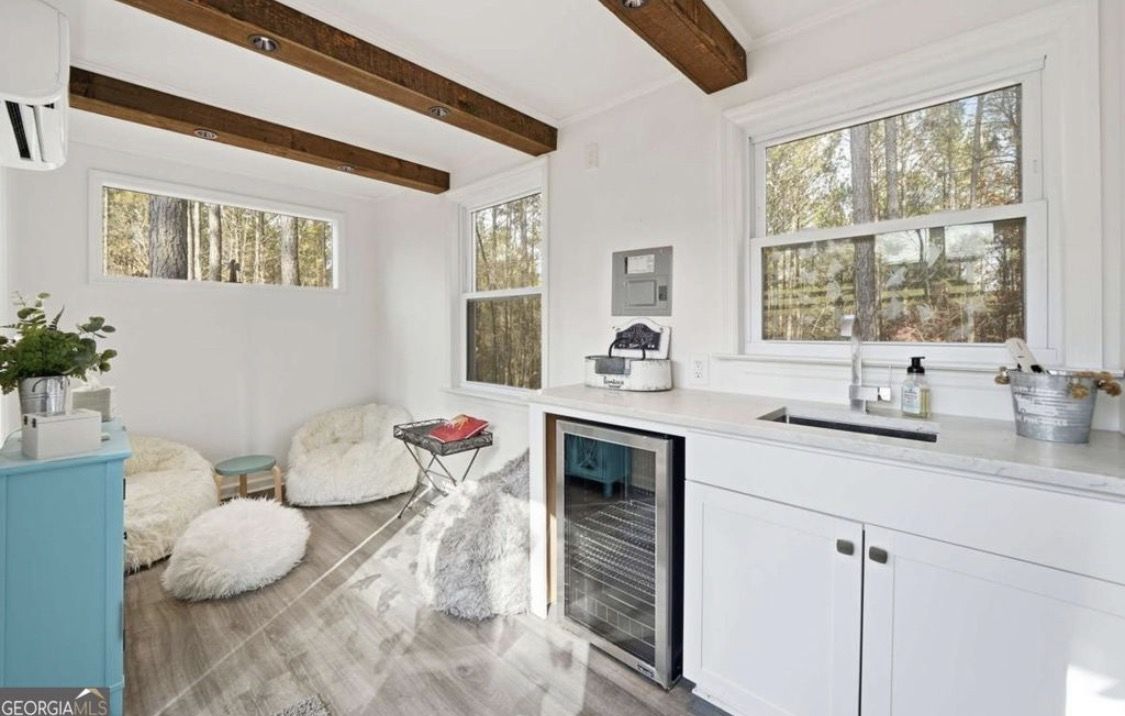 Lounge with beverage fridge and cozy seating